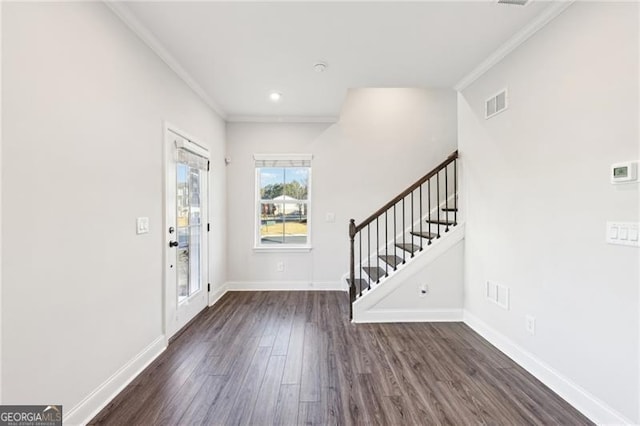 entryway featuring dark hardwood / wood-style floors and crown molding