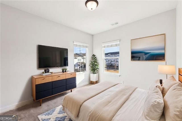 bedroom with light carpet