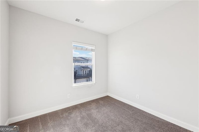 unfurnished room featuring carpet flooring