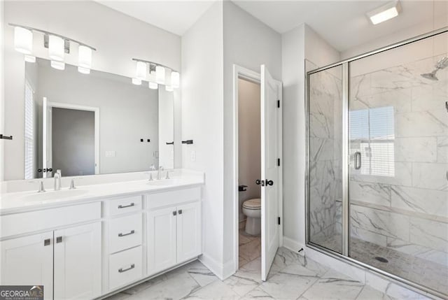 bathroom with vanity, toilet, and an enclosed shower