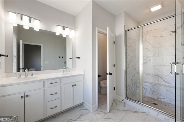 bathroom featuring vanity, toilet, and walk in shower