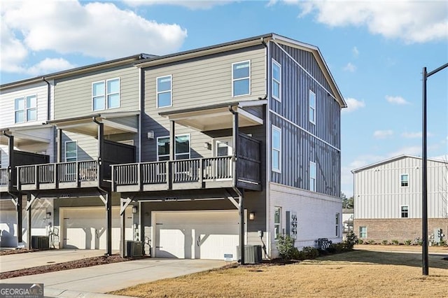 exterior space with cooling unit and a garage