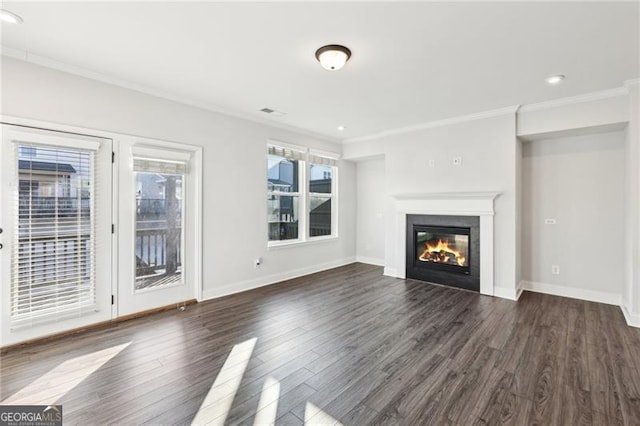 unfurnished living room with dark hardwood / wood-style floors and ornamental molding