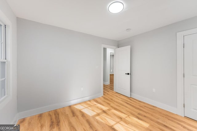 spare room with light hardwood / wood-style floors