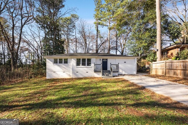 back of house featuring a lawn