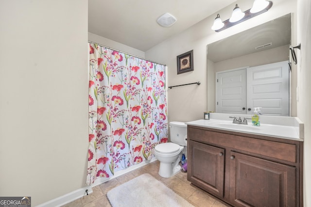 bathroom with tile patterned flooring, vanity, toilet, and curtained shower