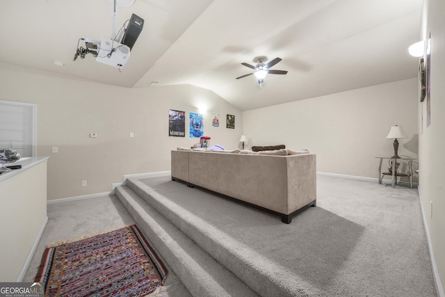 living room featuring ceiling fan, lofted ceiling, and light carpet