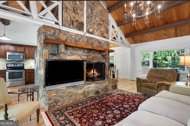 living room with light wood-type flooring, beam ceiling, high vaulted ceiling, wooden ceiling, and a stone fireplace