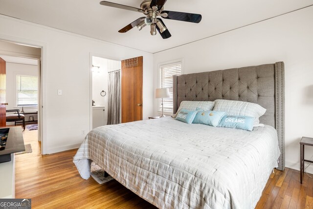 bedroom with hardwood / wood-style floors and ceiling fan