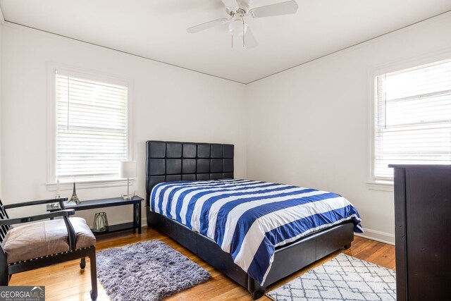 bedroom featuring ceiling fan and wood-type flooring