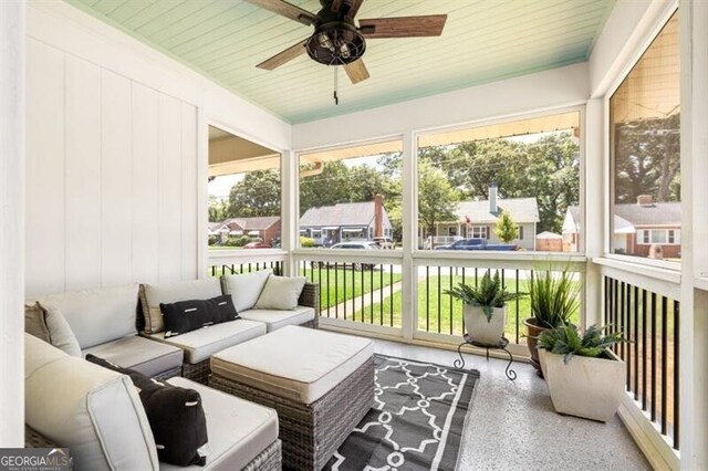 sitting room featuring a wealth of natural light, crown molding, and light hardwood / wood-style floors