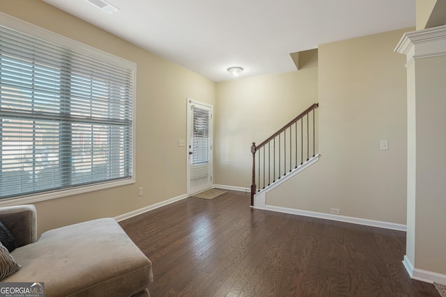 foyer entrance with dark wood-type flooring