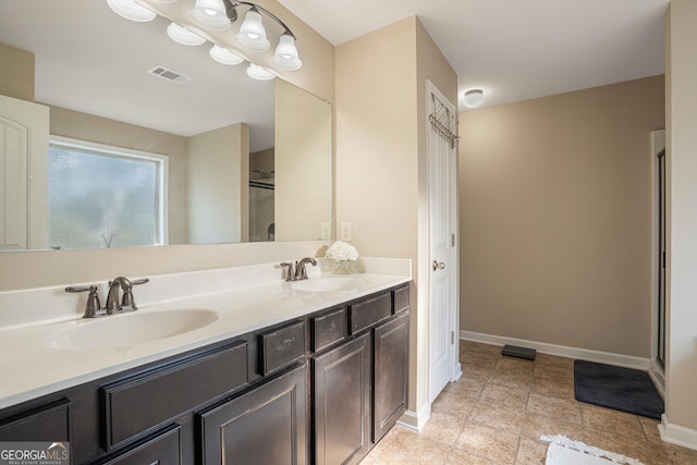 bathroom with vanity and an enclosed shower