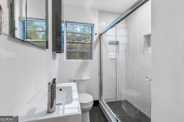 bathroom with vanity, an enclosed shower, and toilet