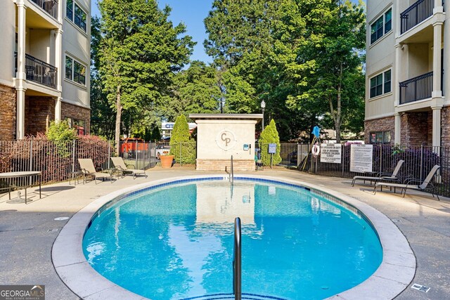 view of pool featuring a patio