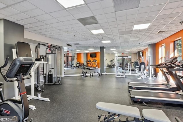 workout area with a paneled ceiling