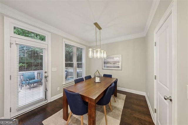 dining space with dark hardwood / wood-style flooring and ornamental molding