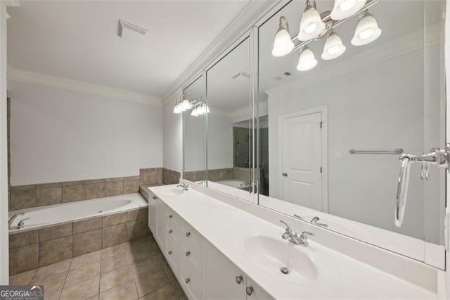 bathroom featuring tile patterned floors, tiled bath, crown molding, and vanity