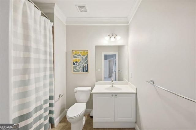 bathroom with toilet, vanity, tile patterned floors, and crown molding