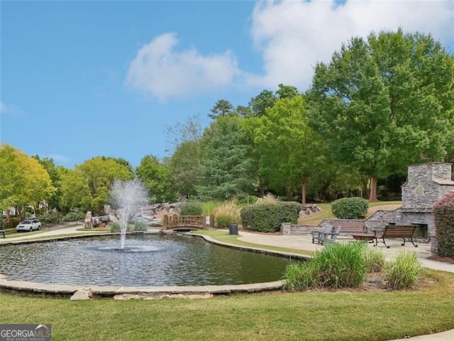 surrounding community featuring a water view