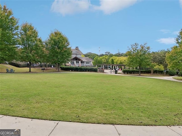 view of home's community with a lawn