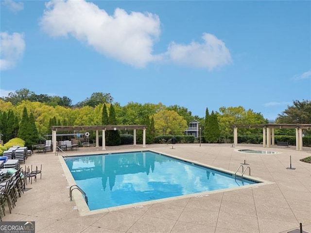 view of pool featuring a patio and a pergola