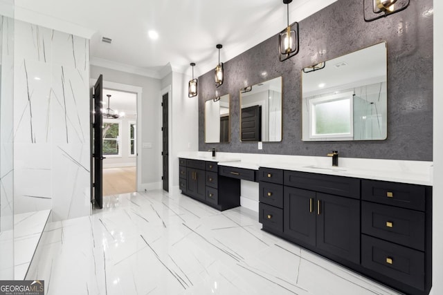 bathroom featuring crown molding and vanity