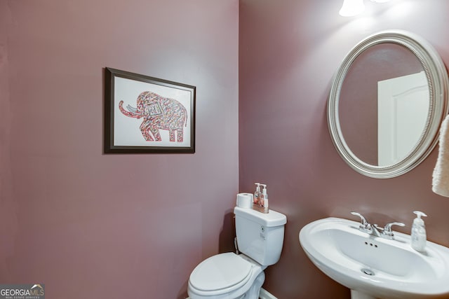 bathroom with sink and toilet