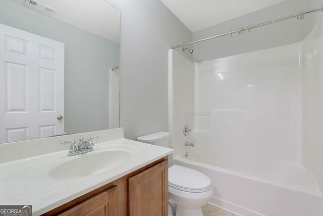 full bathroom with vanity, shower / bath combination, and toilet