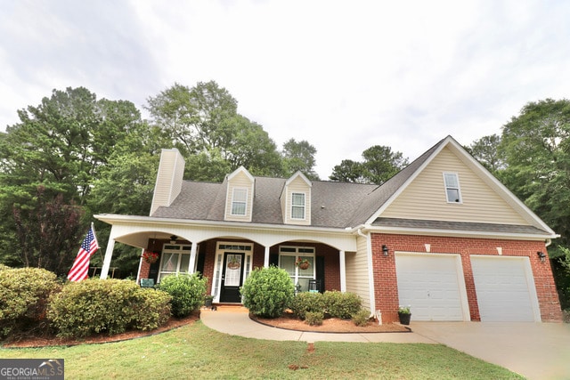 view of front of home featuring covered porch and a front lawn