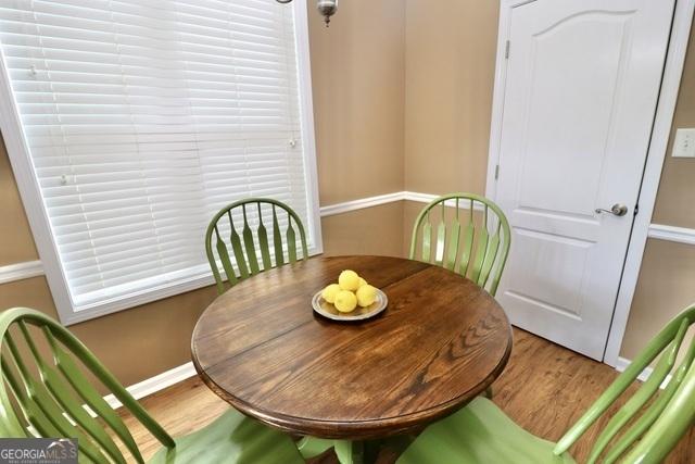 dining room with hardwood / wood-style flooring