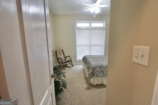 bedroom with ceiling fan and carpet floors