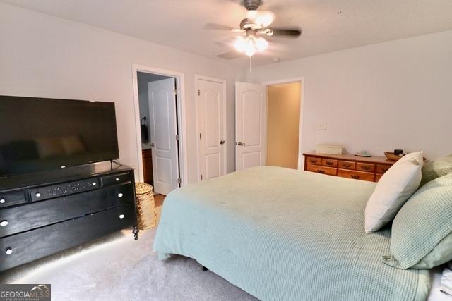 bedroom with carpet flooring and ceiling fan