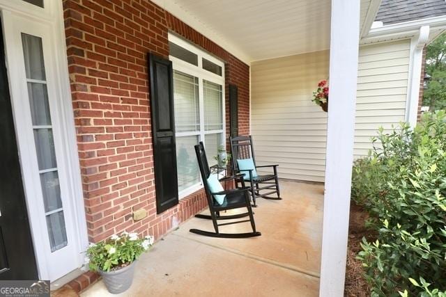 view of patio featuring a porch