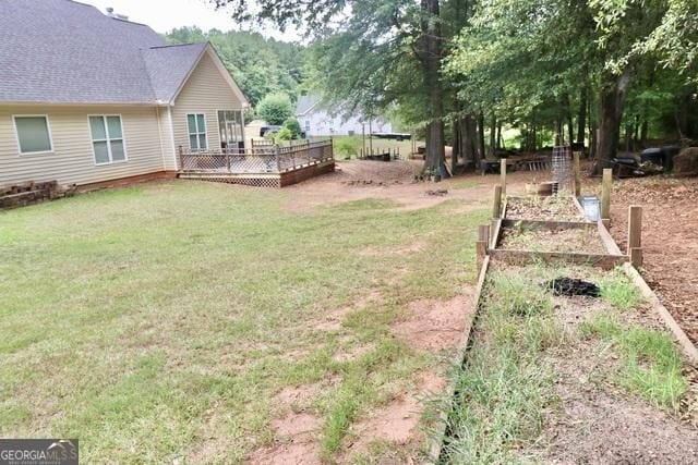 view of yard with a wooden deck