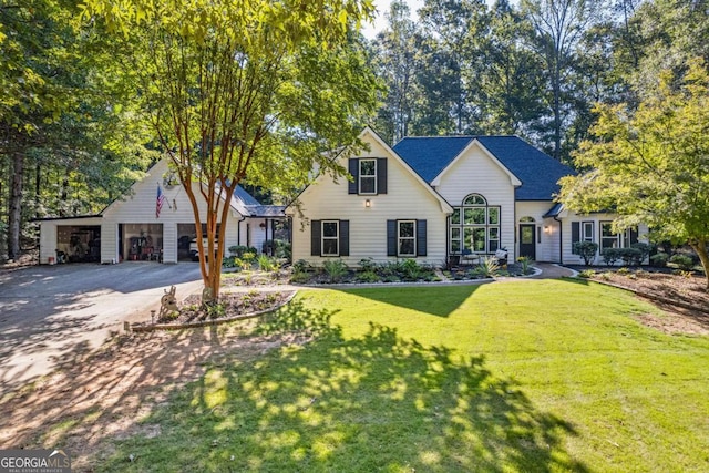 view of front of property with a front lawn and a garage