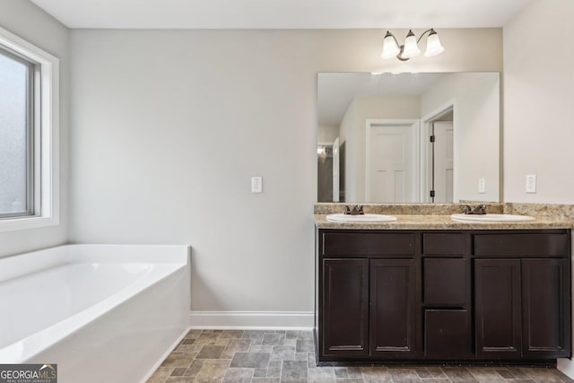 bathroom featuring vanity and a bathtub