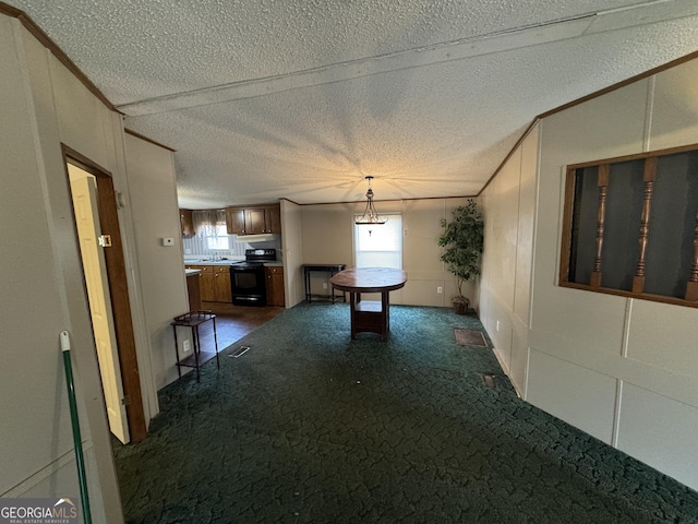 interior space with dark colored carpet, ornamental molding, and sink