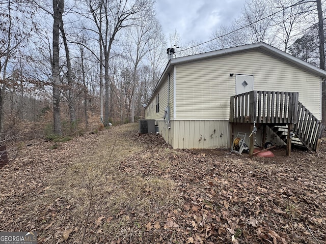 view of side of property featuring cooling unit