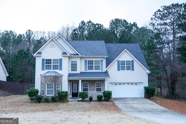 front facade with a porch and a garage