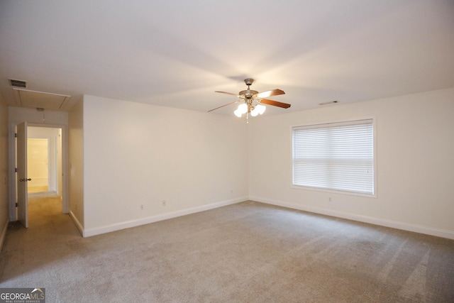 carpeted empty room with ceiling fan