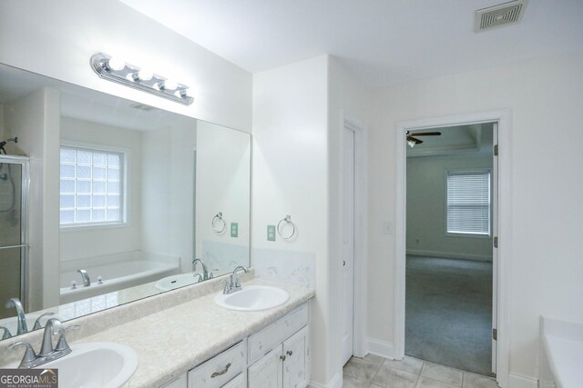 bathroom with vanity, separate shower and tub, and ceiling fan