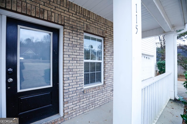 doorway to property with a porch