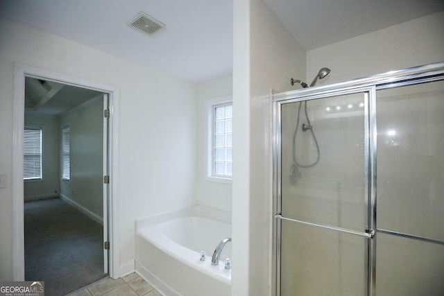 bathroom with tile patterned floors and separate shower and tub