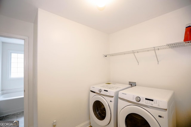 laundry room with washing machine and dryer