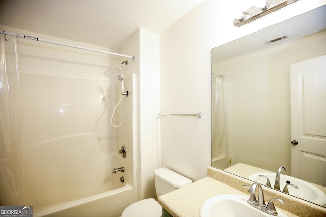 full bathroom with shower / bath combination with curtain, vanity, and toilet