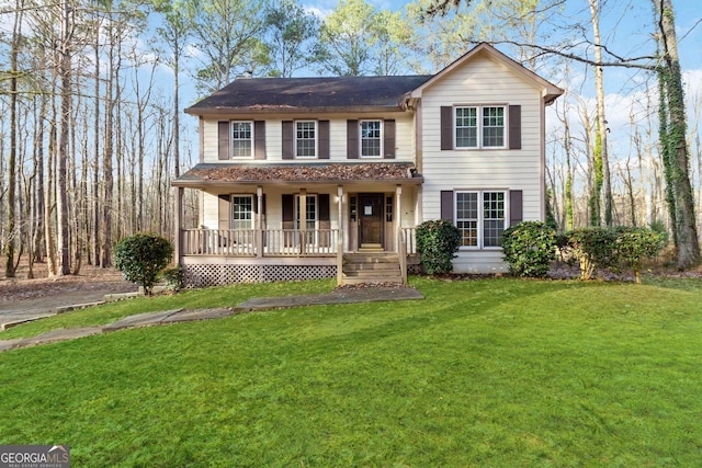 view of front of property featuring a front yard and a porch