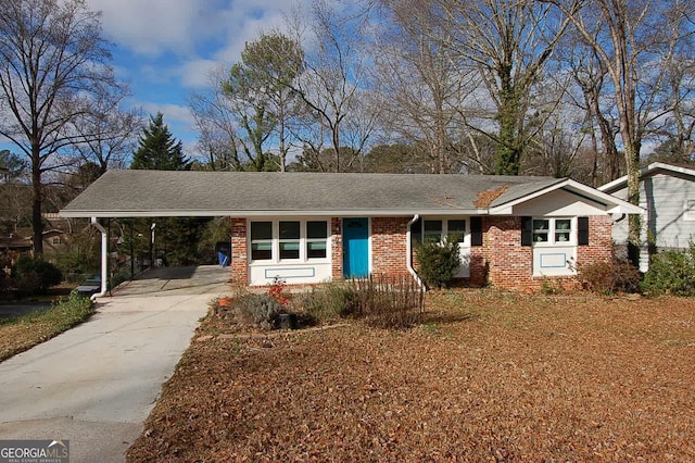 single story home featuring a carport