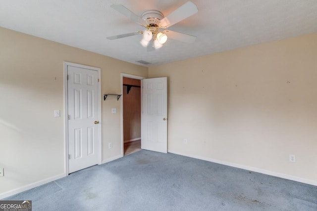 unfurnished bedroom featuring ceiling fan