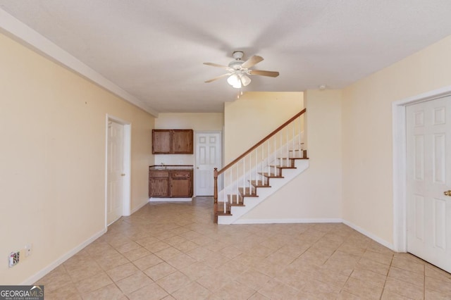 interior space with ceiling fan